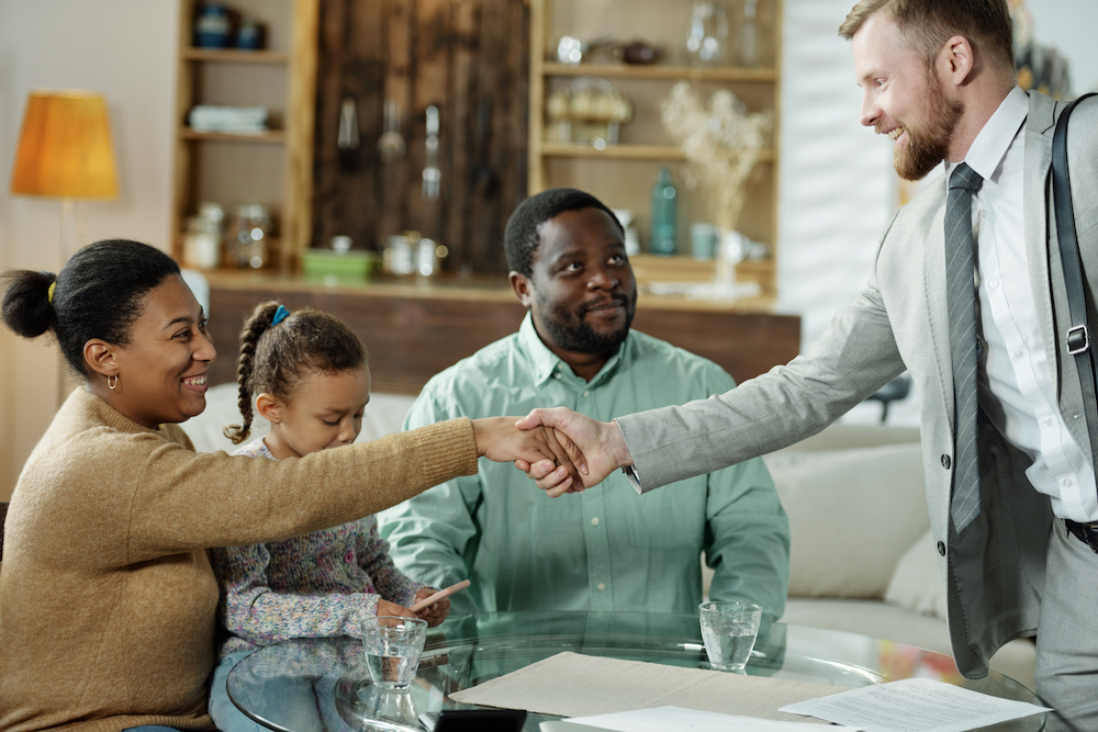 Friendly attorney meeting with ethnic family