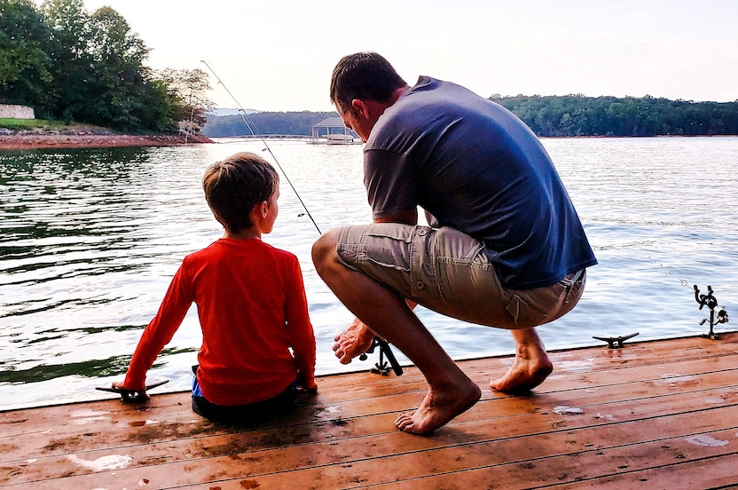 Child custody. Father and son fishing