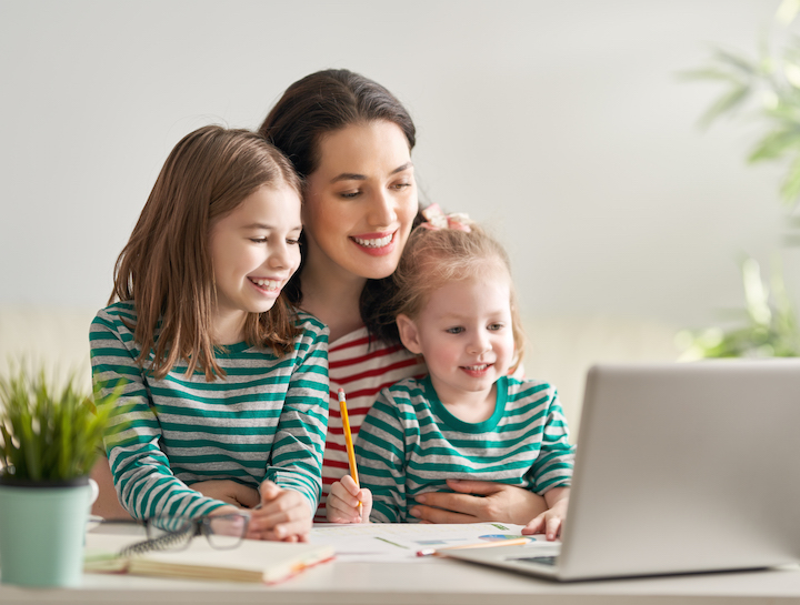 mother with children working on computer