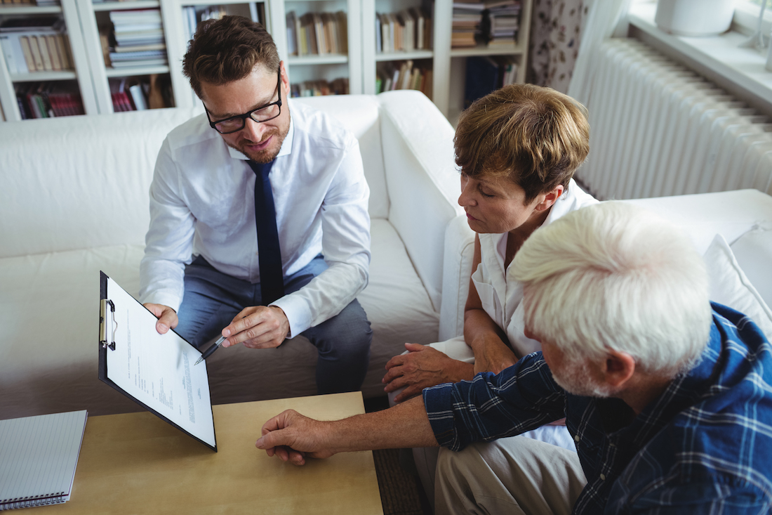 Senior couple planning their estate with attorney