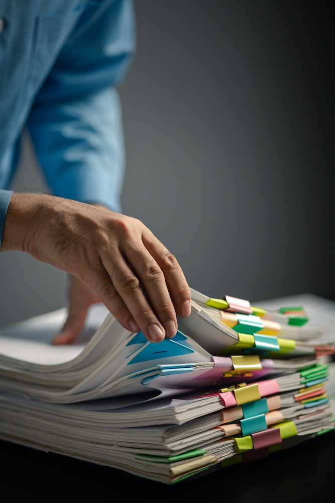 Man preparing personal documents before filing a divorce