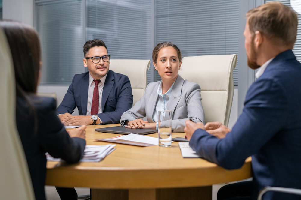 Group of attorneys discussing client strategies