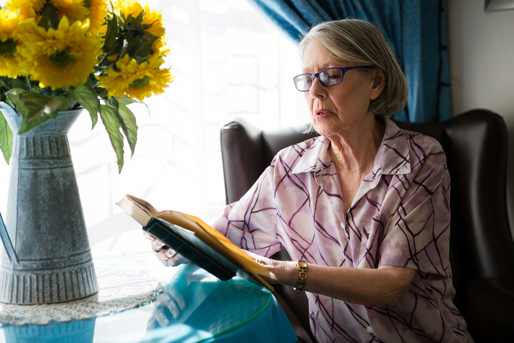 Elderly woman reading